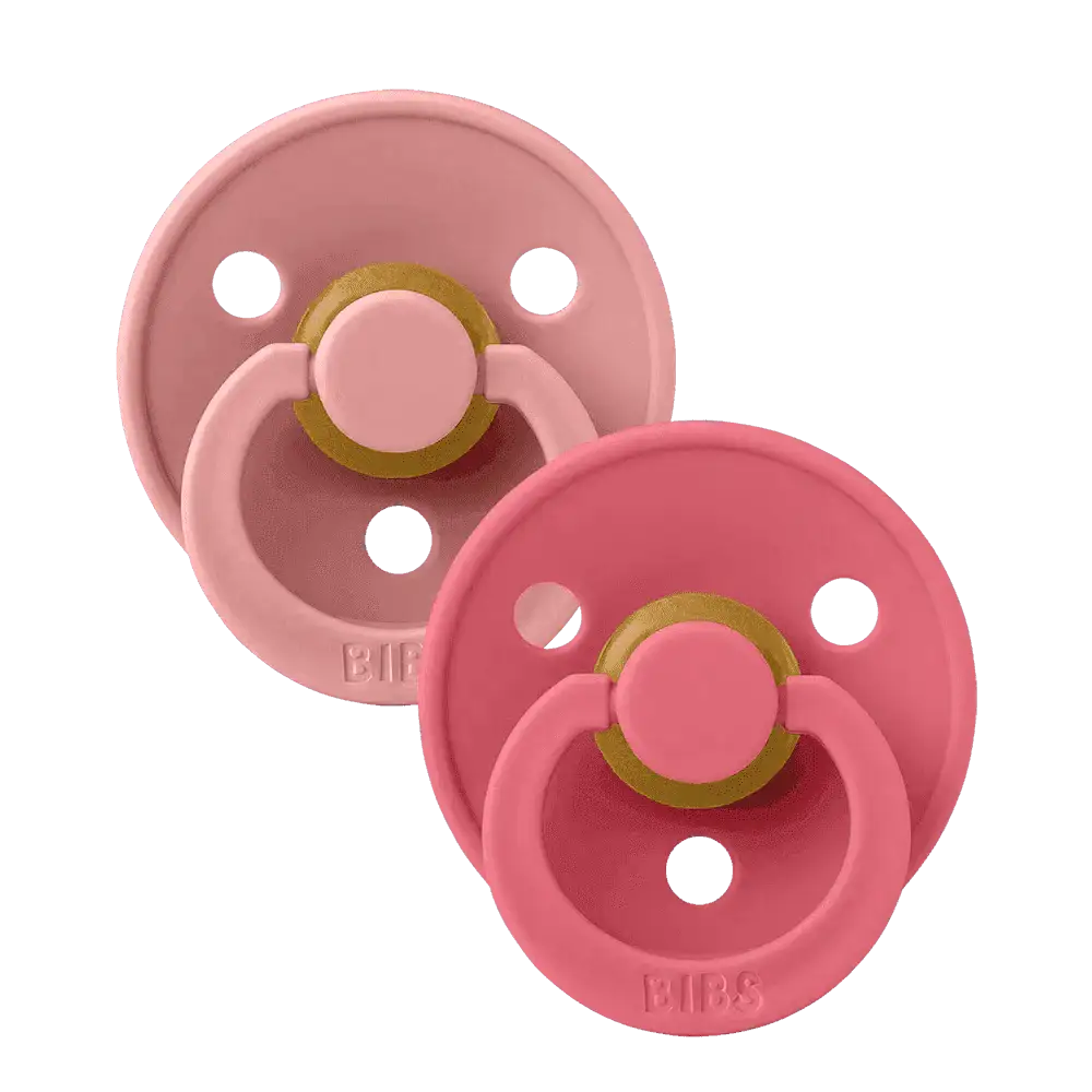 Deux sucettes BIBS Colour Dusty Pink et Coral vues de face, avec leur anneau