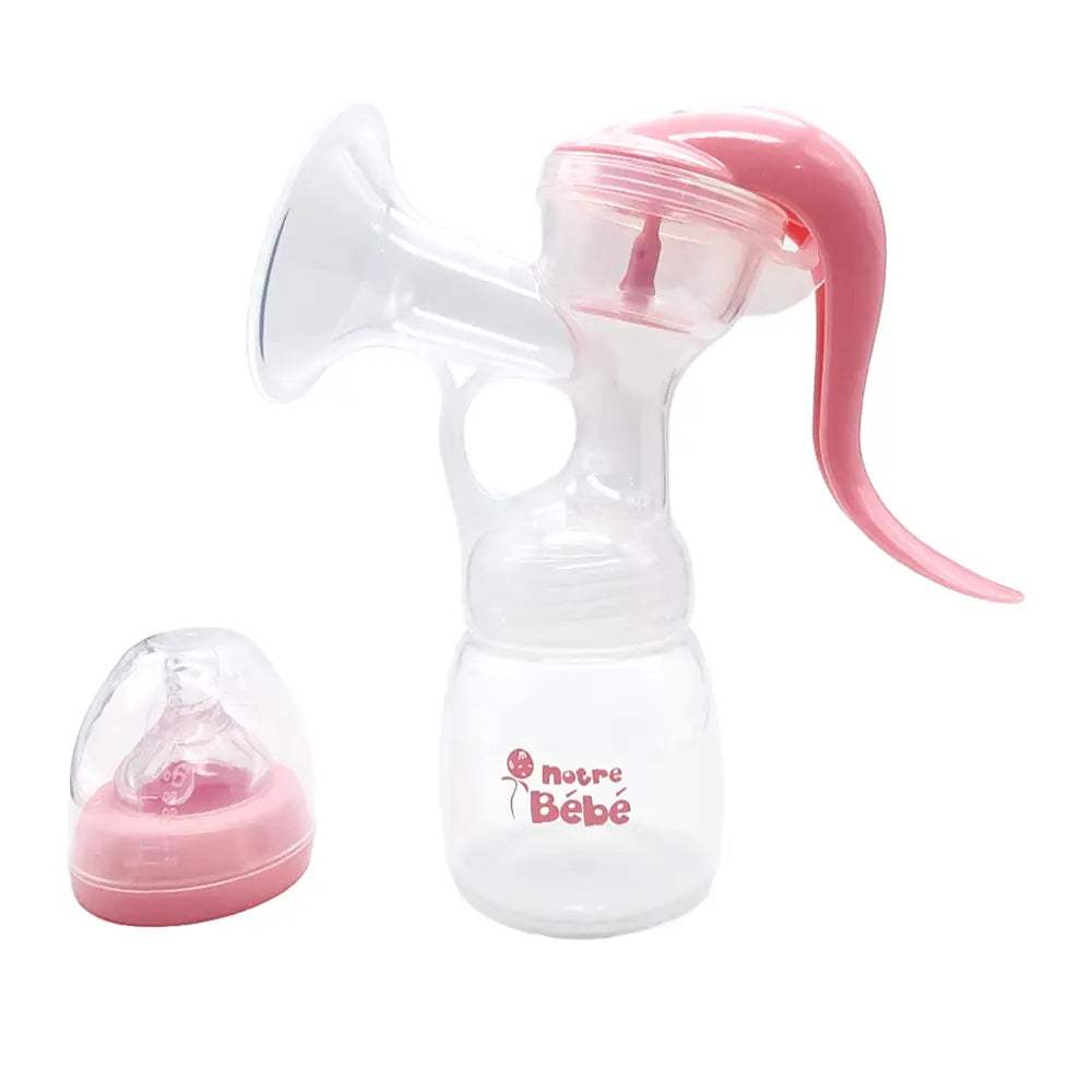 Tire-lait manuel Notre Bébé rose monté sur son biberon, avec la tétine et son capuchon à côté